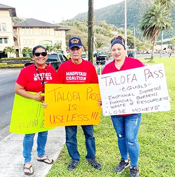Pago Pago chief Pulu Ae Ae Jr., (middle)  protesters