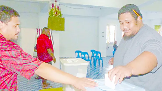 Man puts ballot in ballot box
