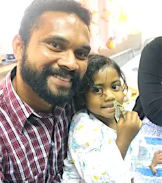 Three-year old Abigail Gaunavou and her father