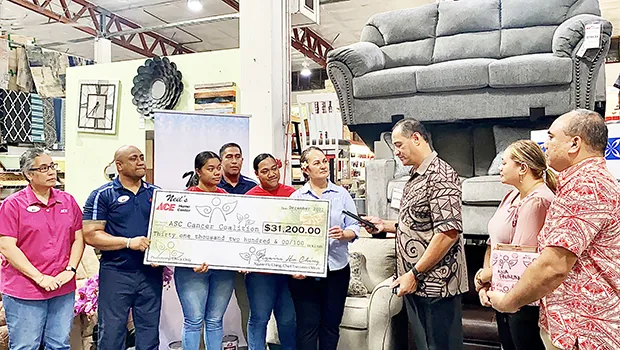 Ngaire Ho-Ching presenting check  to Toetasi Archie Soliai