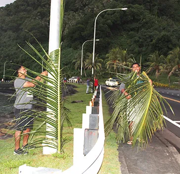 employees from the Department of Administrative Services, Housing Division, were seen at Faganeanea in 2019, decorating the roadside,