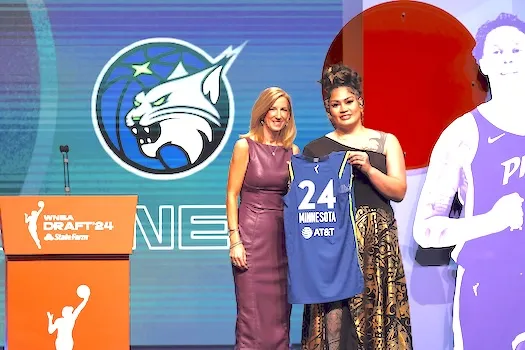 Utah’s Alissa Pili, right, poses for a photo with WNBA commissioner Cathy Engelber