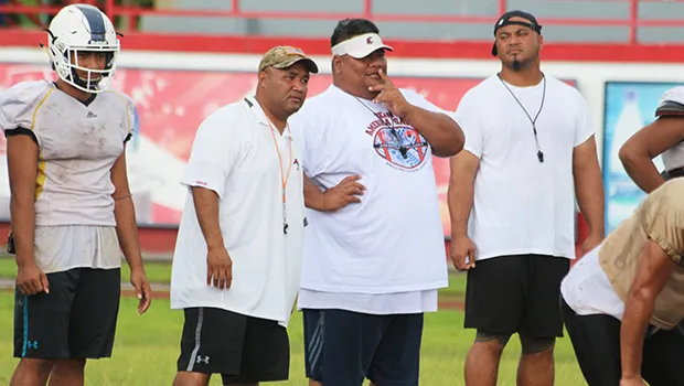 All-Star Head Football Coach, Kevin Magalei speaking with his offensive coordinator, Sua’ese Pooch Ta’ase