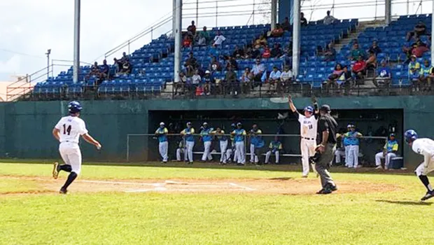 American Samoa's Luke Pagua gets the sign to cruise into home