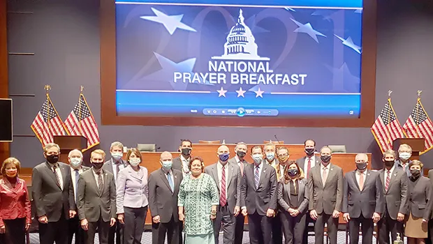 Amata and other Representatives and Senators at the National Prayer Breakfast.