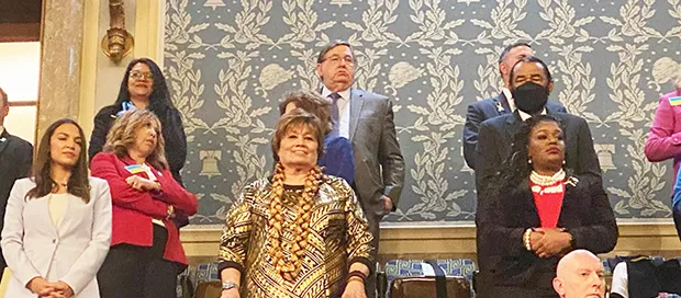 Amata standing with other members of Congress