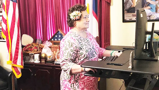 Congresswoman Uifa’atali Amata at desk