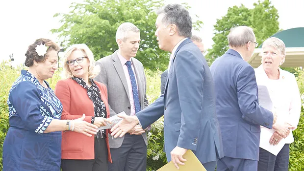 Chairman Takano greeting Congresswoman Amata and Conference Chair Liz Cheney. 