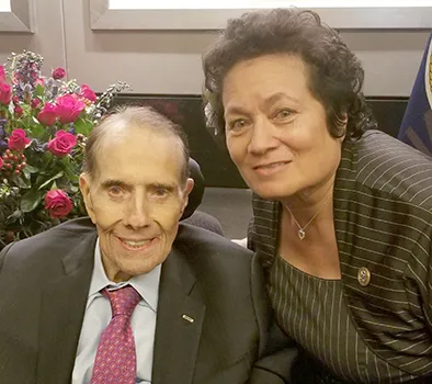 The late Sen. Bob Dole and Congresswoman Uifa’atali Amata