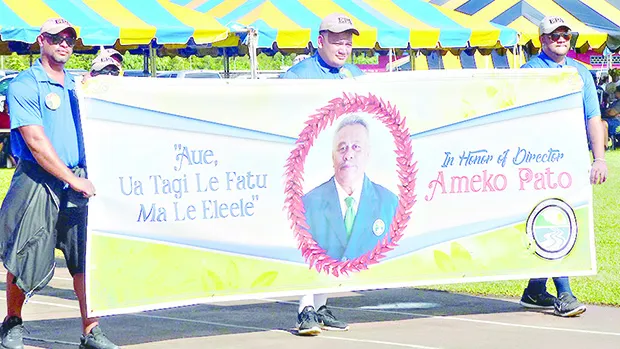 American Samoa Environmental Protection Agency employees with a banner honoring the agency’s executive director Ameko Pato at last Friday’s Workforce Day at Veterans Memorial Stadium. 