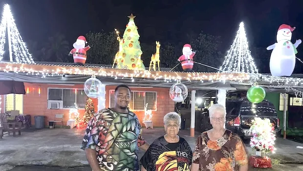 Amiaimalo Ofoia family with Christmas lights