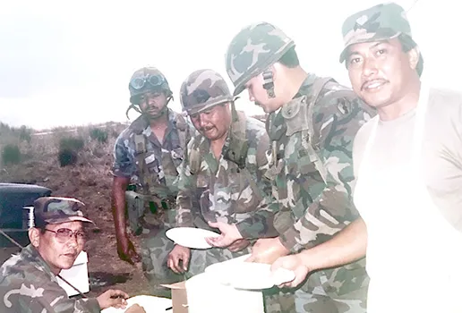 Historical photo of Army Reserve Soldiers from the 100th Infantry Battalion taking a break for a meal