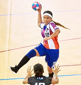 Lynette Liu, jumps to get the ball in the goal