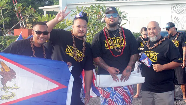 Tanu (Utulei), Charles (Manu’a/Ili’ili), Tau (Manu’a/Atu’u), and Duffy (Manu’a/Petesa) with the American Samoa flag 