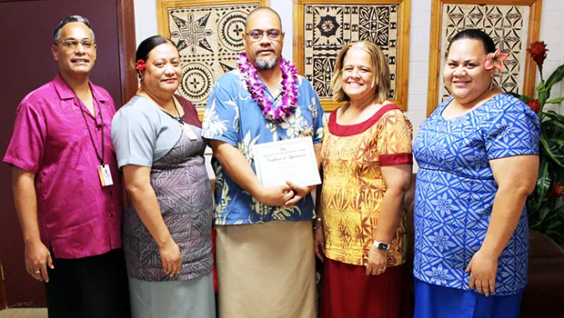 Dr. Rosevonne Pato (2nd left) and ASCC administrators celebrate with Dr. Kamo Koloi (center) 