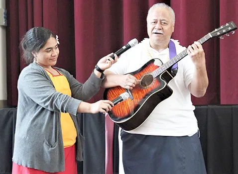 Tapa’au Dr. Dan Aga playing the guitar