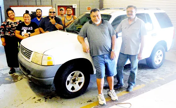 ASCC Trades & Technical Department (TTD) program director Fred Suisala with others and the vehicle 
