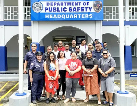 ASCC students and DPS officers outside the Fagatogo police station