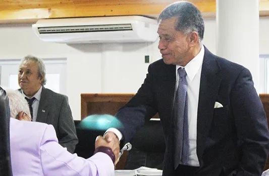 Local Department of Homeland Security director Samana Semo Ve’ave’a shaking hands with senators following a Senate committee hearing