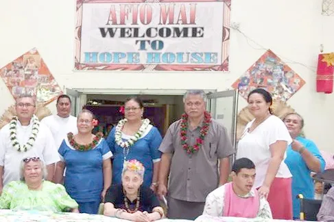 Pictured is Vicar General, Father Viane Etuale (back row, left) and other Diocese of Samoa Pago Pago officials, with three Hope House residents (seated).