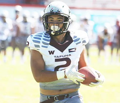 Tafuna Warriors Koison Ozu with the ball