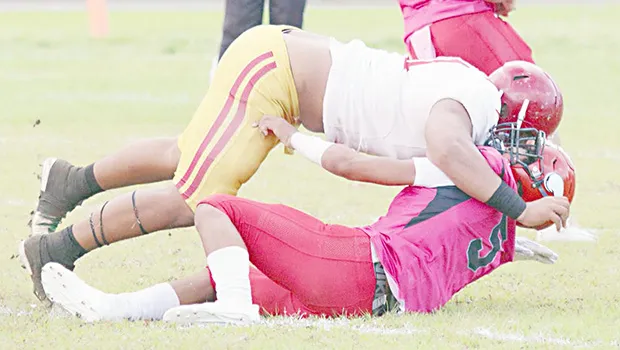 Faga’itua Vikings Ina Ta’ase is stopped immediately in the back by big Francis Mauigoa