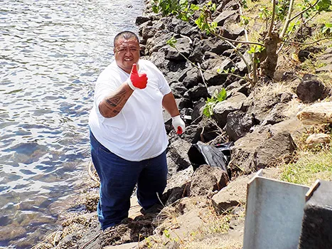 An ASPA employee during a coastal clean up in 2015. 