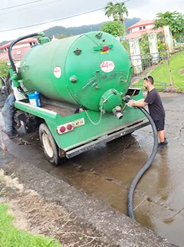 Crew from the American Samoa Power Authority with their vaccumn truck