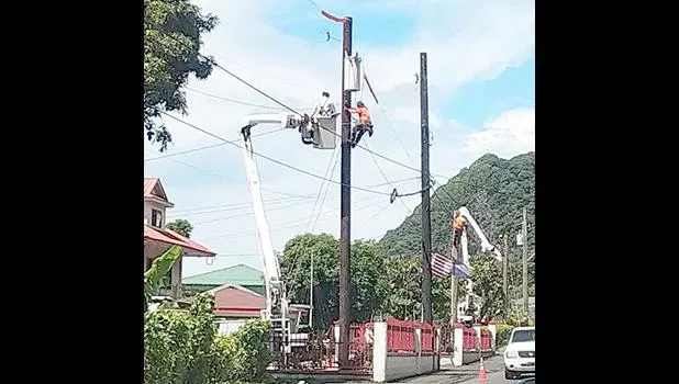 ASPA workers in a bucket truck installing streetlights.