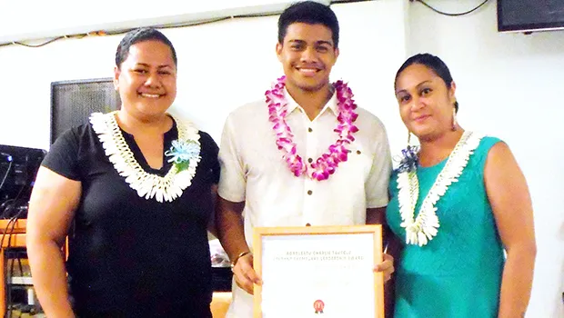  Ionatana Tuitasi received the McDonalds Scholarship from McDonalds American Samoa representatives Delores Tautolo and Katie Afuamua.