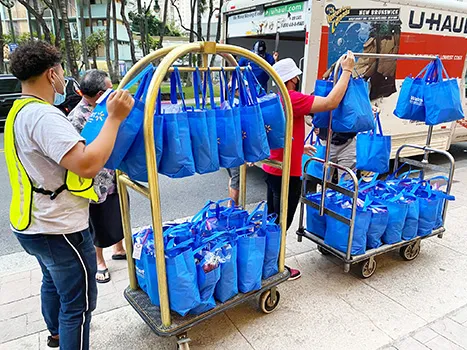 Bags of donations being wheeled to truck for delivery to quarantine center in Honolulu.