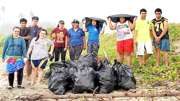 Young people with bags of rubbish picked up