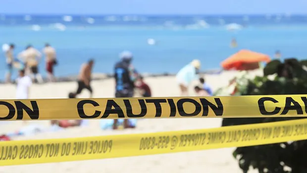 Waikiki beach with yellow caution tape