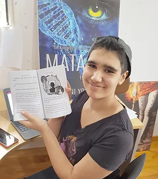 Bella Young displays one of her illustrations