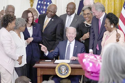 President Joe Biden points to Opal Lee after signing the Juneteenth National Independence Day Act