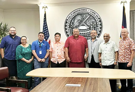 Gov. Lemanu P.S. Mauga and ASG staffers in a group photo with personnel from Bluesky and its parent company