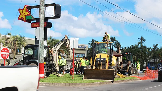 Heavy equipment removing bus stop in front of Laufou 