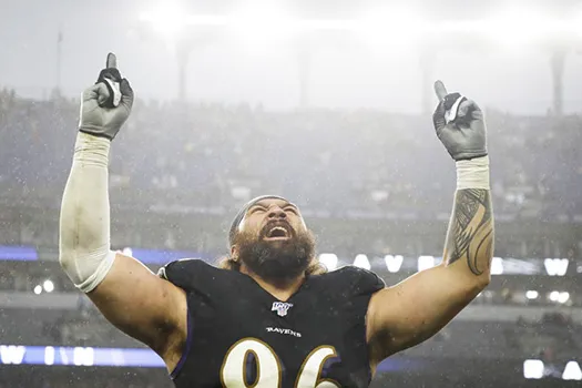 Domata Peko celebrates