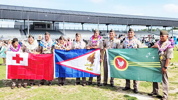 Cadets and their flags at U.S Army Basic Combat Training graduation