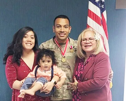 Capt. Paunga with his wife, mother and son