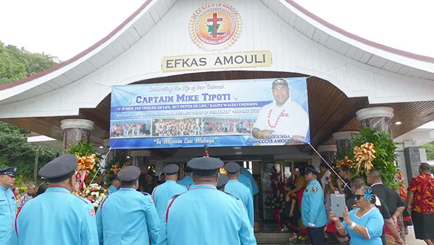 DPS Fire Bureau walk into the Congregational Christian Church of American Samoa in Amouli for a family-service yesterday morning for the late Capt. Mike Asiasiga Olive Tipoti, 