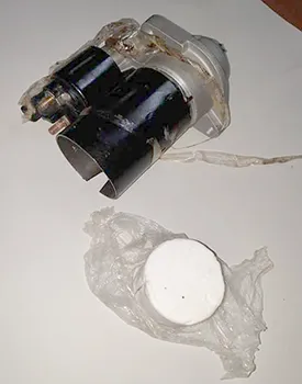 A car part and the baggie of cocaine found in it