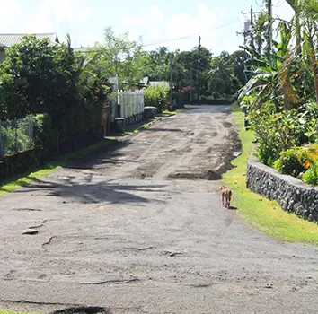 emporary fix -with gravel and cinder - filling the now gone large potholes on the Cardinal Pio Road