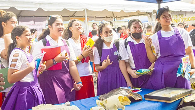 Studfents at an information booth curing Environmental Career Day