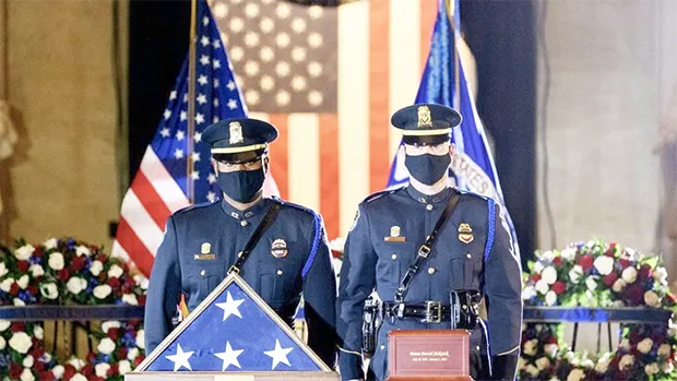 The Capitol Police Force honor guard with flag and ashes