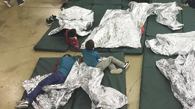   A photo provided by U.S. Customs and Border Protection shows the interior of a CBP facility in McAllen, Texas, on Sunday. Immigration officials have separated thousands of families who crossed the border illegally. Reporters taken on a tour of the facility were not allowed by agents to interview any of the detainees or take photos, the AP reported. U.S. Customs and Border Protection's Rio Grande Valley Sector via AP 