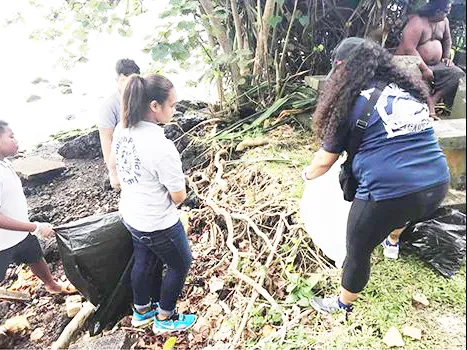 People picking up trash at Pala Lagoon