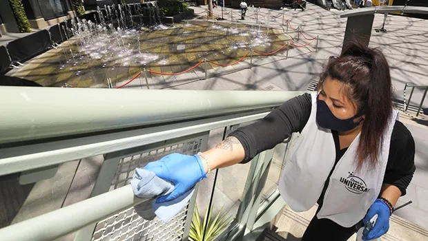 Woman cleaning a stair railing