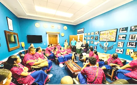 close up delegates in Amata's office