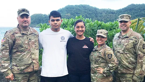 Cody McMoore (2nd from left) and Florine Roe (center) 